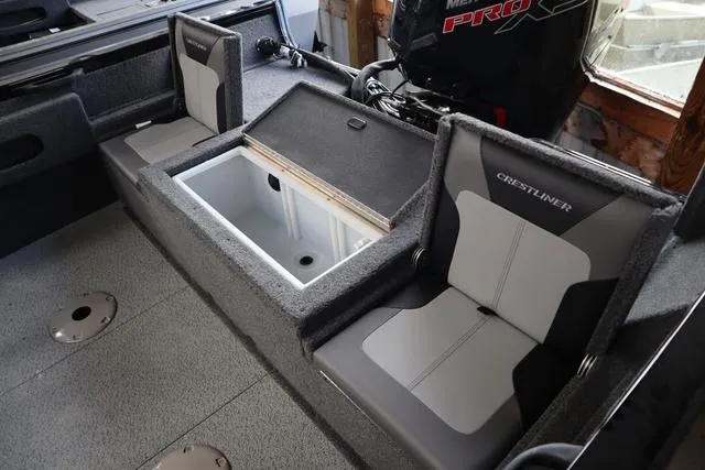 Slide: The Image of 2025 Crestliner 1750 HAWK SC JS boat interior with seating and storage compartments. - 7