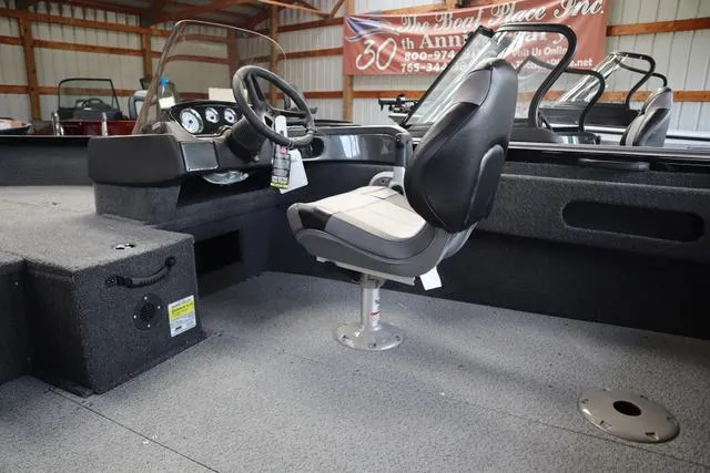 Slide: The Image of 2025 Crestliner 1750 HAWK SC JS boat interior with steering console and seating. - 8