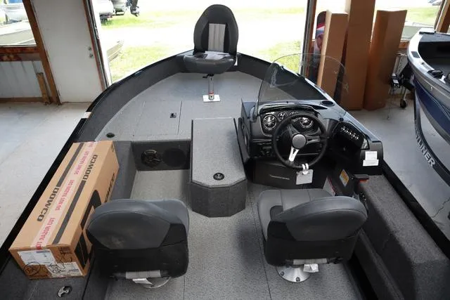 Slide: The Image of 2024 Lowe FM 1775 SC fishing boat interior with seating and control panel. - 3