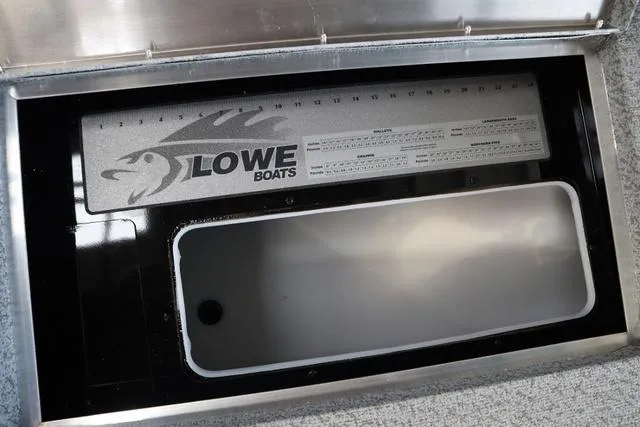 Slide: The Image of 2024 Lowe FM 1775 SC boat storage compartment with measurement guide. - 4