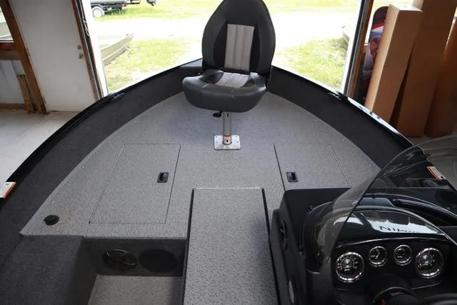 Slide: The Image of 2024 Lowe FM 1775 SC boat interior with seating and dashboard. - 6