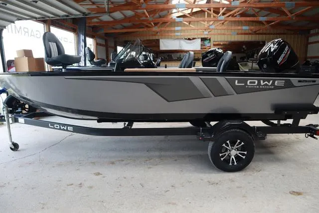 Slide: The Image of 2024 Lowe FM 1775 SC fishing boat in a garage, side view. - 7