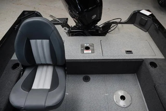 Slide: The Image of 2024 Lowe FM 1775 SC boat interior with seating and motor area. - 8