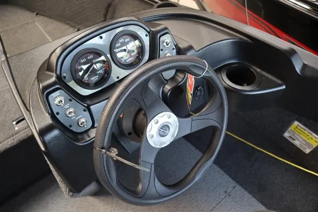 Slide: The Image of 2025 Crestliner 1650 Kodiak SC dashboard with steering wheel and gauges. - 3
