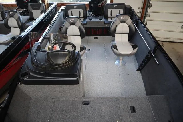 Slide: The Image of 2025 Crestliner 1650 Kodiak SC boat interior with seating and steering console. - 5