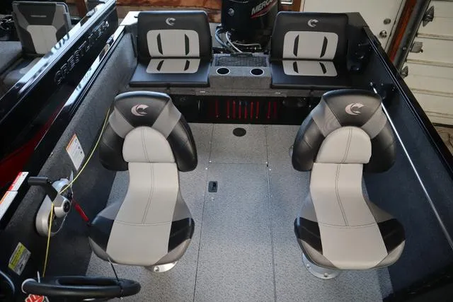Slide: The Image of Interior of 2025 Crestliner 1650 Kodiak SC boat with modern seating and controls. - 9