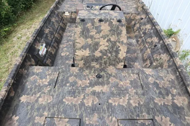 Slide: The Image of 2024 Crestliner 1870 Retriever FCC Tunnel boat with camouflage interior design. - 3