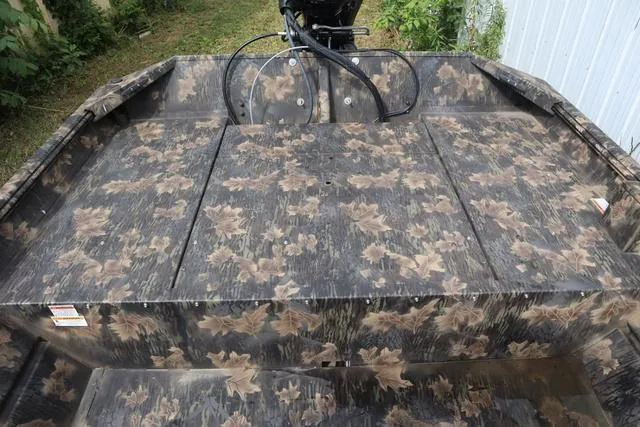 Slide: The Image of 2024 Crestliner 1870 Retriever FCC Tunnel boat with camouflage pattern. - 7
