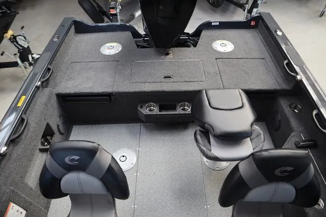 Slide: The Image of 2025 Crestliner 1850 Fish Hawk WT JS interior with seating and storage compartments. - 4