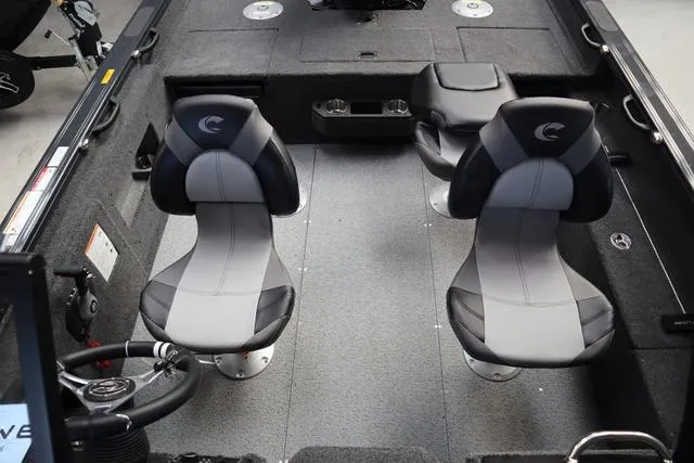 Slide: The Image of 2025 Crestliner 1850 Fish Hawk WT JS interior with two seats and steering wheel. - 8