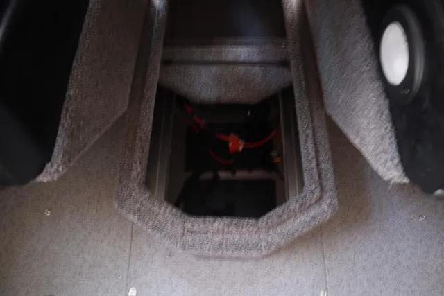 Slide: The Image of Interior view of 2025 Lowe FM 1775 WT boat storage compartment. - 12