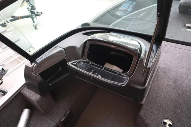 Slide: The Image of 2025 Lowe FM 1775 WT boat interior with open storage compartment. - 3