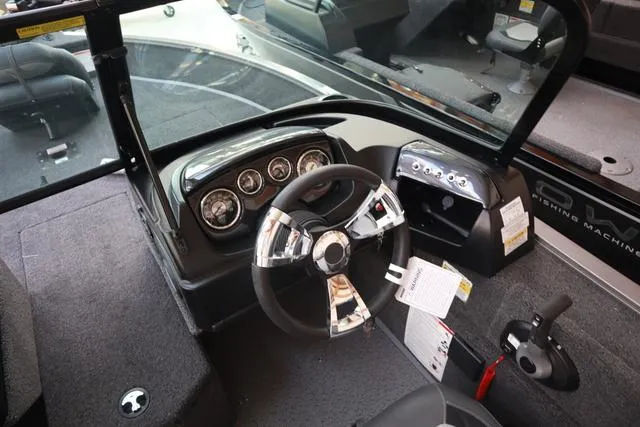 Slide: The Image of 2025 Lowe FM 1775 WT boat dashboard with steering wheel and instrument panel. - 7