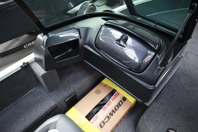 Slide: The Image of Interior of 2025 Lowe FM 1775 WT boat with storage compartment and box. - 12