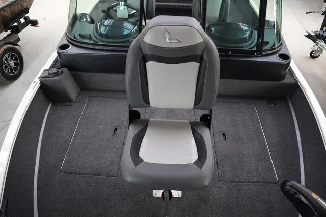 Slide: The Image of 2025 Lowe FM 1775 WT boat interior with a central seat and carpeted flooring. - 15