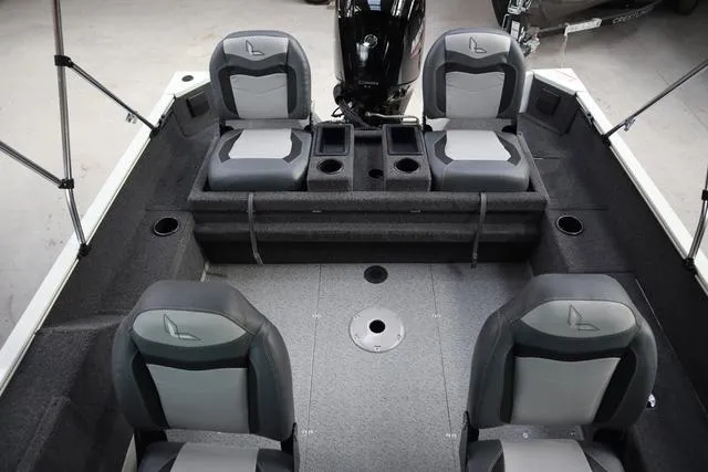 Slide: The Image of 2025 Lowe FM 1775 WT boat interior with four seats and storage compartments. - 17