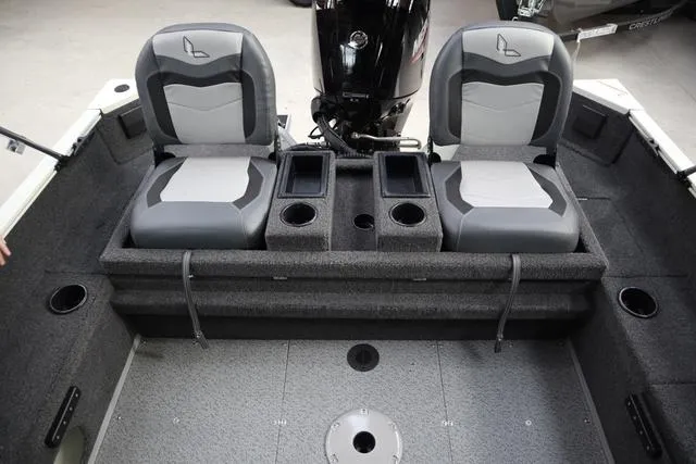 Slide: The Image of 2025 Lowe FM 1775 WT boat interior with dual seats and storage compartments. - 19