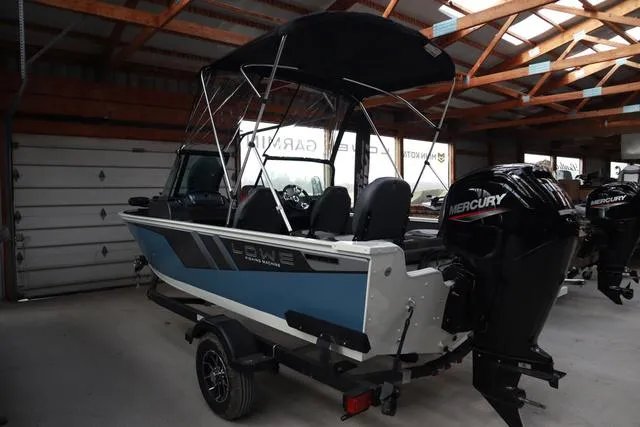 Slide: The Image of 2025 Lowe FM 1775 WT boat with Mercury engine in a garage setting. - 3