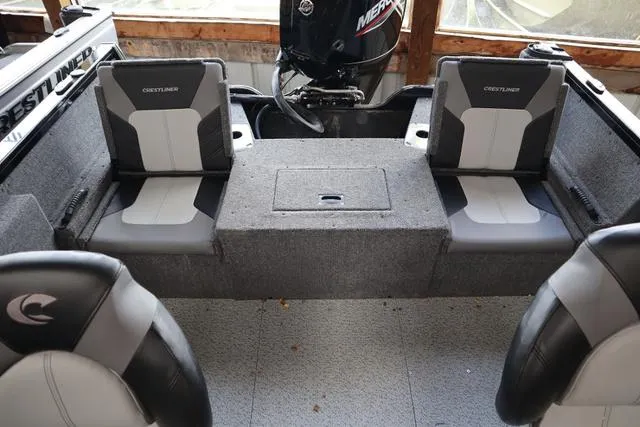 Slide: The Image of 2024 Crestliner 1650 Fish Hawk JS SC interior with seating and motor. - 5