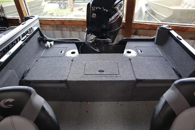 Slide: The Image of 2024 Crestliner 1650 Fish Hawk JS SC boat interior with Mercury engine. - 6