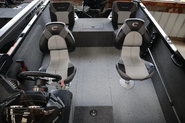 Slide: The Image of 2024 Crestliner 1650 Fish Hawk JS SC interior with two seats and steering console. - 7