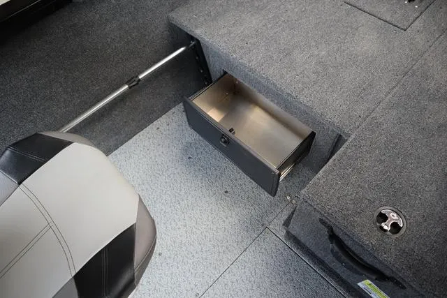 Slide: The Image of 2024 Crestliner 1650 Fish Hawk JS SC interior with open storage compartment. - 9