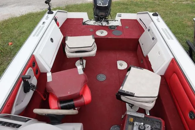 Slide: The Image of 1997 Princecraft 178 boat interior with red and white seating and carpet. - 8