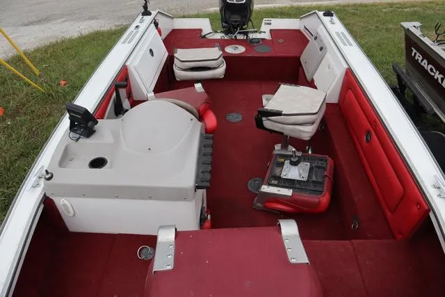 Slide: The Image of 1997 Princecraft 178 boat interior with red seating and fishing equipment. - 9