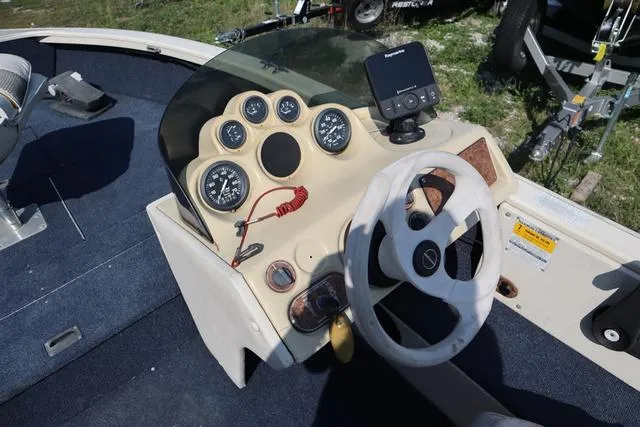 Slide: The Image of 1997 Crestliner 1750 Fish Hawk SC boat dashboard with steering wheel and gauges. - 6