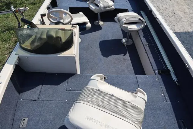 Slide: The Image of 1997 Crestliner 1750 Fish Hawk SC interior with seating and steering console. - 8