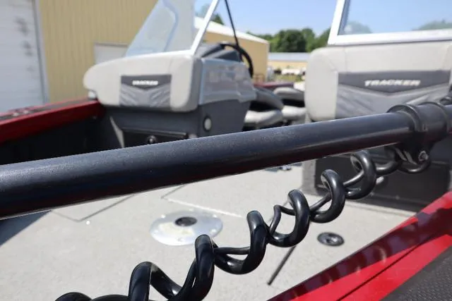 Slide: The Image of 2019 Tracker Targa™ V-18 Combo boat interior with seats and fishing rod holder. - 4