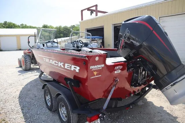 Slide: The Image of 2019 Tracker Targa™ V-18 Combo boat with outboard motor, parked on a trailer. - 5