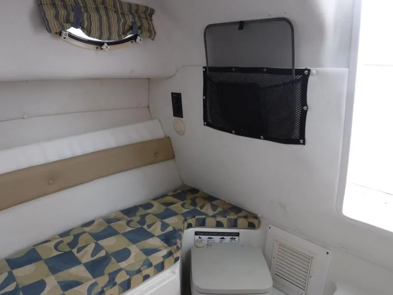 Slide: The Image of 2008 Pro-Line 26 XP cabin interior with seating and storage. - 11