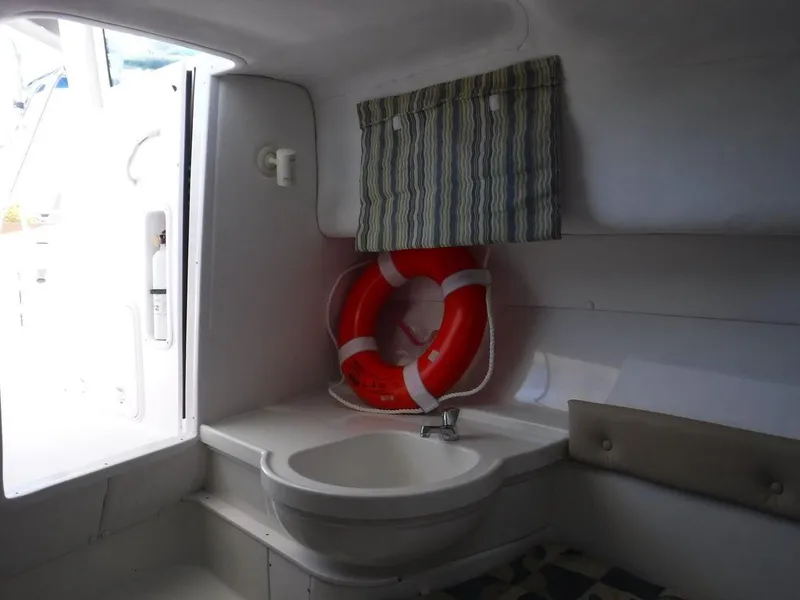 Slide: The Image of Interior of 2008 Pro-Line 26 XP boat with sink and life preserver. - 12
