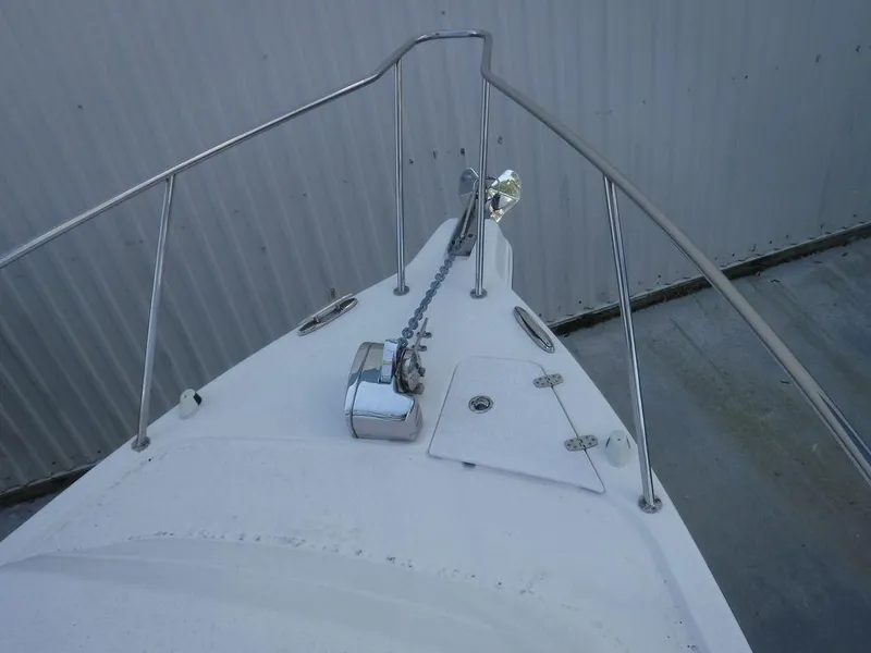 Slide: The Image of 2008 Pro-Line 26 XP boat bow with anchor chain and railing. - 13