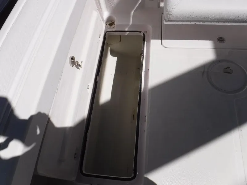 Slide: The Image of Open storage compartment on 2008 Pro-Line 26 XP boat deck. - 16
