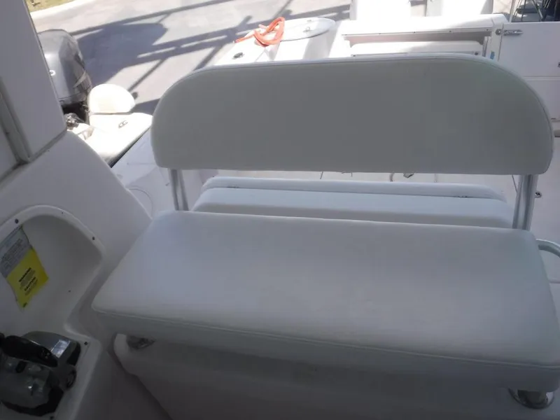 Slide: The Image of 2008 Pro-Line 26 XP boat interior with white cushioned seating. - 19