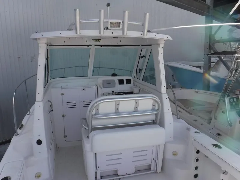 Slide: The Image of 2008 Pro-Line 26 XP boat interior with helm and seating area. - 2