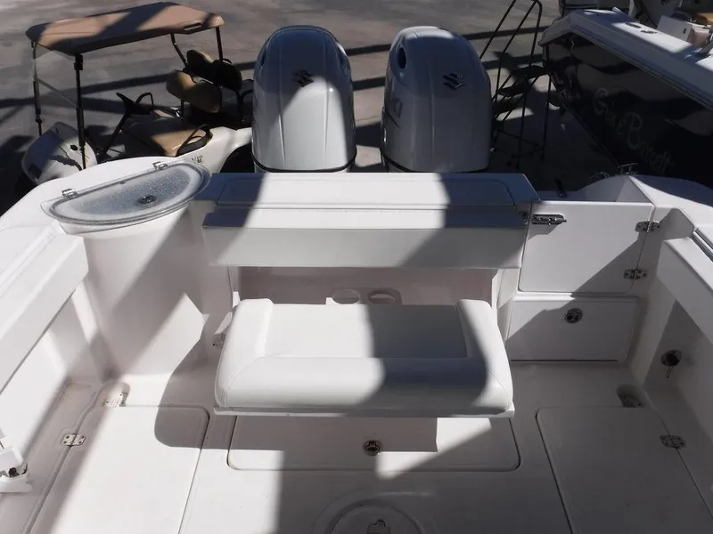Slide: The Image of 2008 Pro-Line 26 XP boat interior with dual engines and seating area. - 21