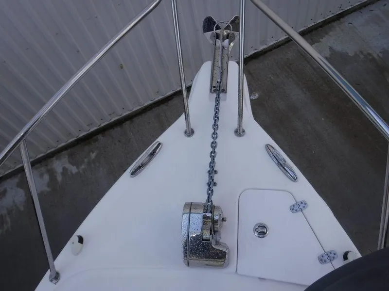 Slide: The Image of Bow of 2008 Pro-Line 26 XP boat with anchor chain and railing. - 22