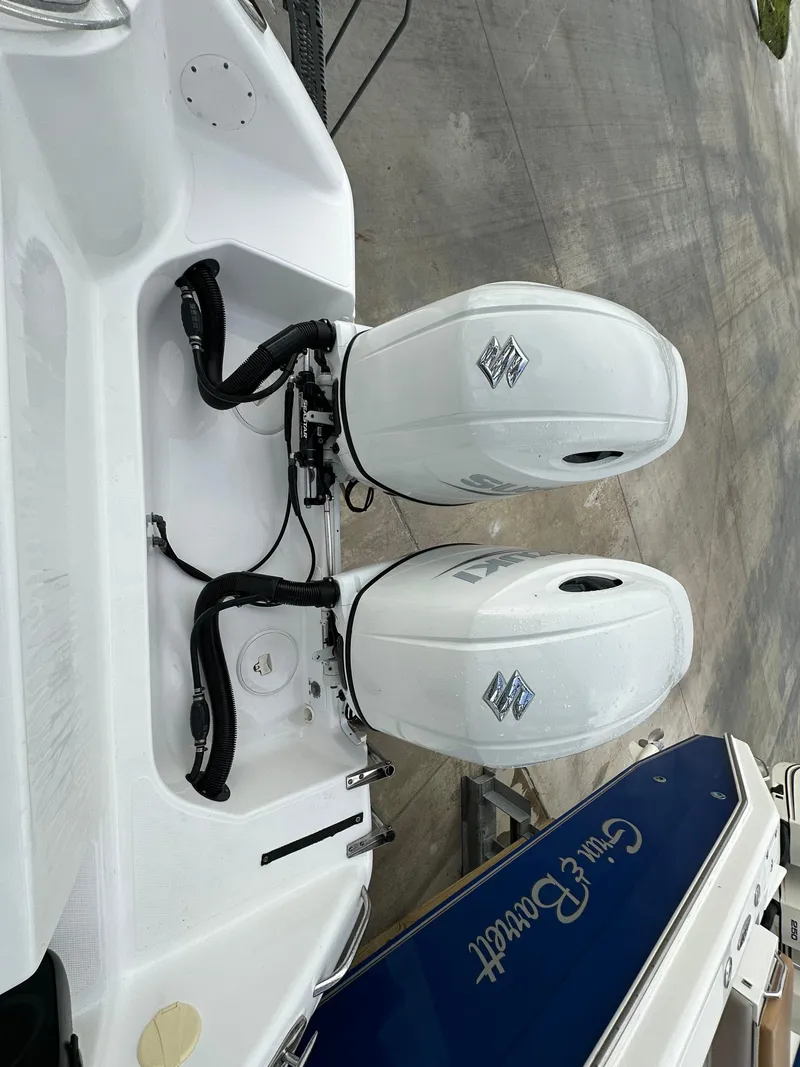 Slide: The Image of 2008 Pro-Line 26 XP boat with dual outboard engines on a concrete surface. - 26