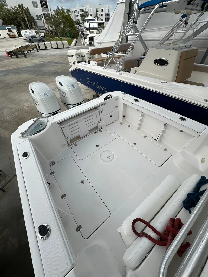 Slide: The Image of 2008 Pro-Line 26 XP boat with spacious deck and dual outboard motors. - 27
