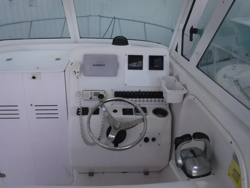 Slide: The Image of 2008 Pro-Line 26 XP boat helm with Garmin navigation and control panel. - 3