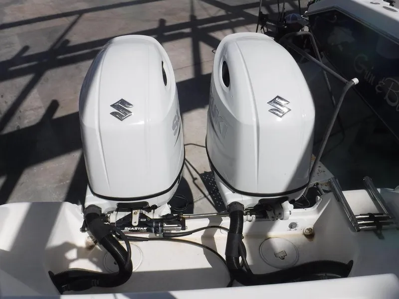 Slide: The Image of Twin Suzuki outboard motors on a 2008 Pro-Line 26 XP boat. - 6