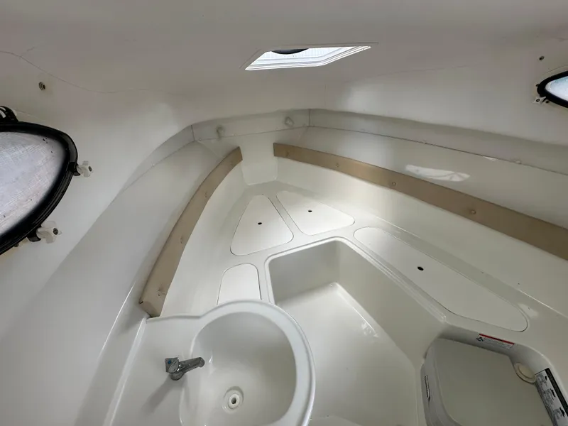 Slide: The Image of 2008 Pro-Line 26 XP boat interior with sink and storage compartments. - 9