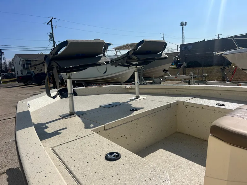 Slide: The Image of 2019 Xpress H20B boat with dual seats, parked outdoors under clear sky. - 4