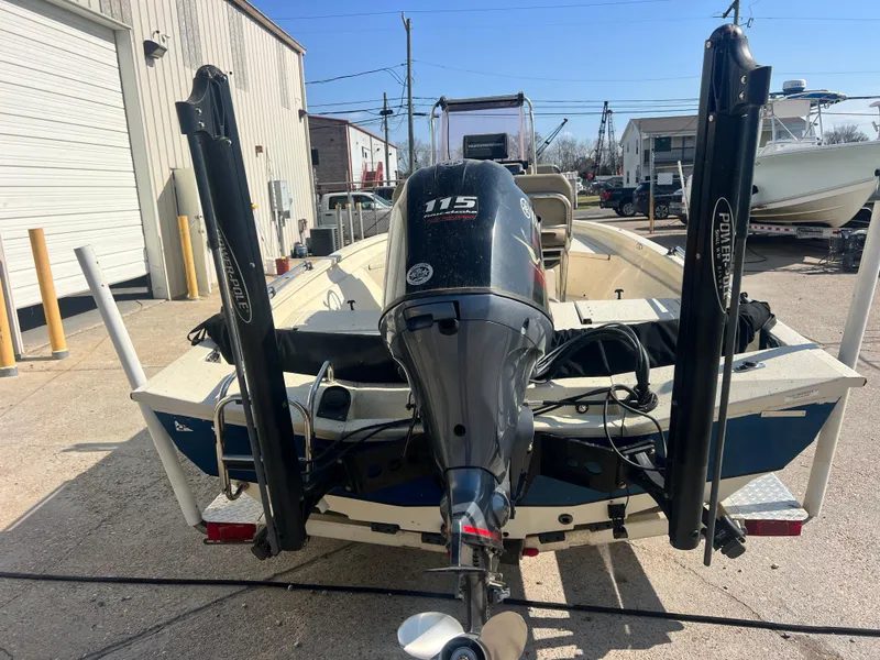 Slide: The Image of 2019 Xpress H20B boat with 115 horsepower outboard motor, parked outdoors. - 7