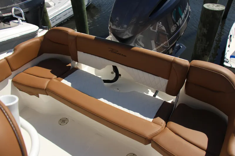 Slide: The Image of 2025 Pioneer 202 Islander boat with tan seating and Yamaha outboard motor. - 9