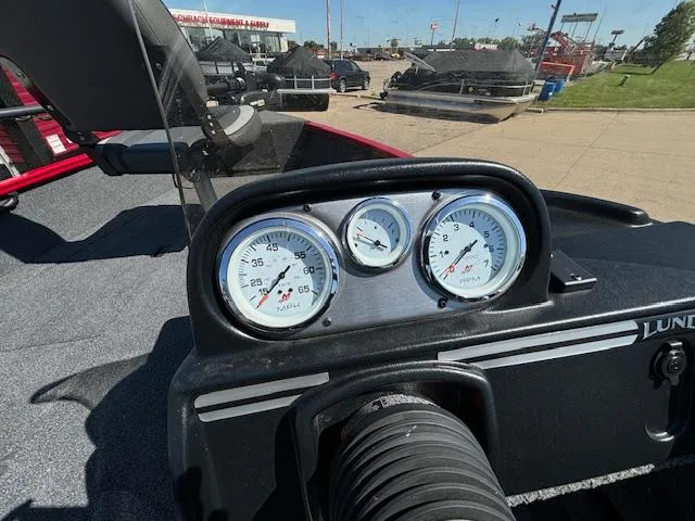 Slide: The Image of Dashboard of 2022 Lund 1675 Adventure SS boat with gauges and controls. - 14