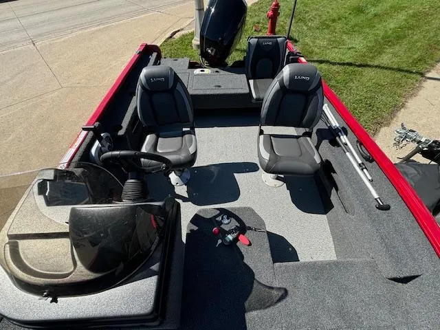 Slide: The Image of 2022 Lund 1675 Adventure SS boat interior with seating and steering console. - 25